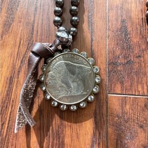 Buffalo coin necklace.
